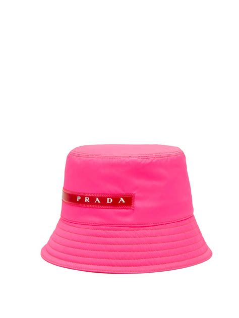 hot pink prada bucket hat.